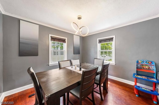 896 Maurice Ave, Rahway City, NJ 07065 - dining space featuring ornamental molding, dark wood-style floors, baseboards, a textured ceiling, and a chandelier