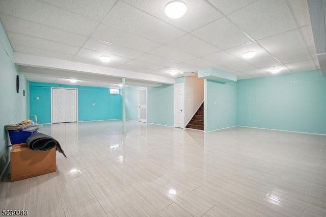 12 Hudson Dr, Bernards Twp, NJ 07920 - finished basement featuring stairs, a paneled ceiling, and baseboards