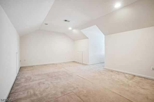 12 Hudson Dr, Bernards Twp, NJ 07920 - additional living space with vaulted ceiling, light carpet, baseboards, and recessed lighting