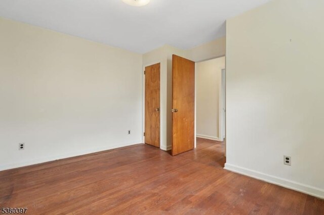 6 Emery Ave, Mendham Boro, NJ 07945 - unfurnished room with wood finished floors and baseboards