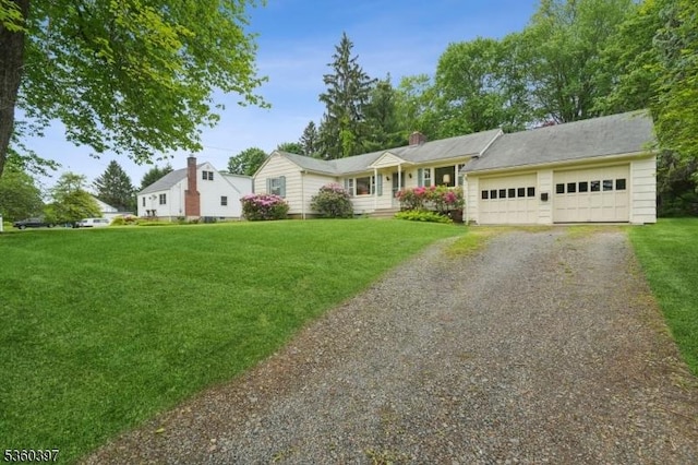 6 Emery Ave, Mendham Boro, NJ 07945 - view of front facade featuring driveway, a front lawn, an attached garage, and a chimney