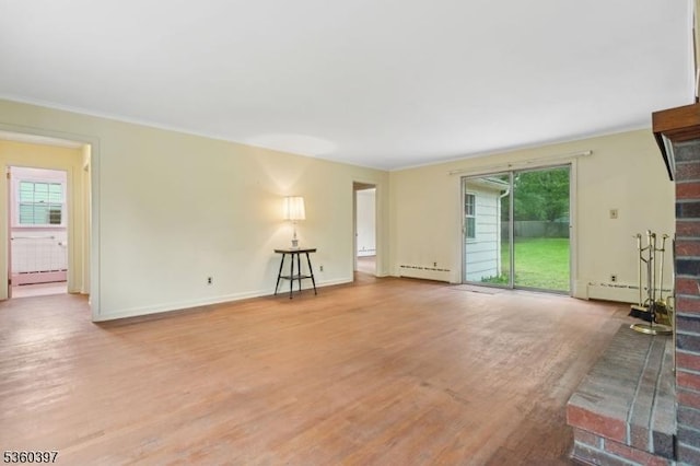 6 Emery Ave, Mendham Boro, NJ 07945 - unfurnished living room with a baseboard radiator, plenty of natural light, wood finished floors, and ornamental molding