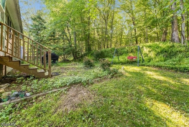 34 Brookwood Dr, Byram Twp, NJ 07874 - view of yard with stairway and a wooded view