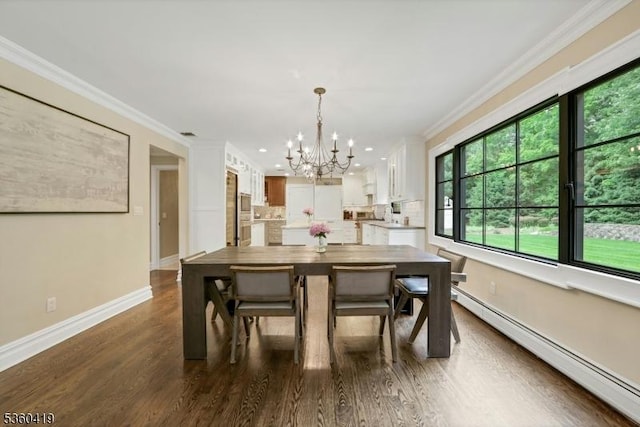 325 Hobar Ct, Franklin Lakes Boro, NJ 07417 - dining area with a baseboard radiator, a chandelier, ornamental molding, dark wood-style flooring, and baseboards