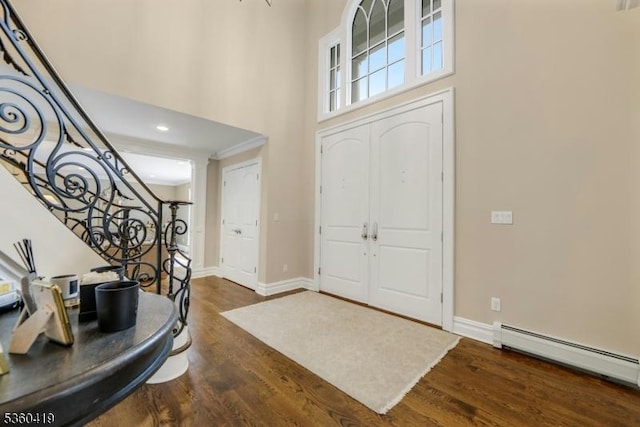 325 Hobar Ct, Franklin Lakes Boro, NJ 07417 - foyer entrance with a baseboard radiator, wood finished floors, a high ceiling, stairway, and baseboards