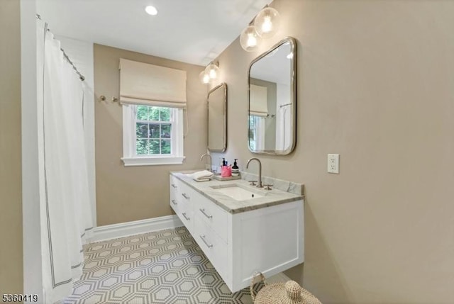 325 Hobar Ct, Franklin Lakes Boro, NJ 07417 - bathroom featuring double vanity, baseboards, and tile patterned floors