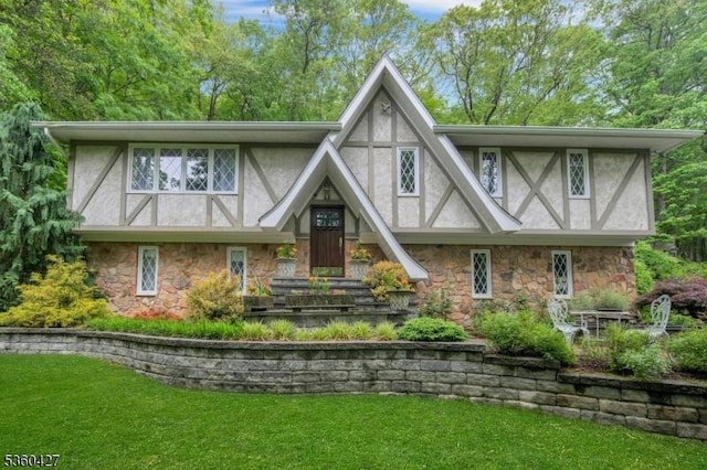 151 Hurd St, Mine Hill Twp, NJ 07803 - tudor-style house featuring stone siding, stucco siding, and a front lawn