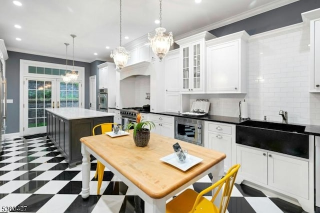 151 Hurd St, Mine Hill Twp, NJ 07803 - kitchen with stainless steel appliances, a sink, a chandelier, a center island, and white cabinetry