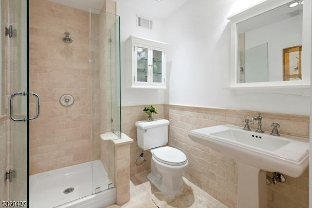 151 Hurd St, Mine Hill Twp, NJ 07803 - bathroom with toilet, a shower stall, wainscoting, and a sink
