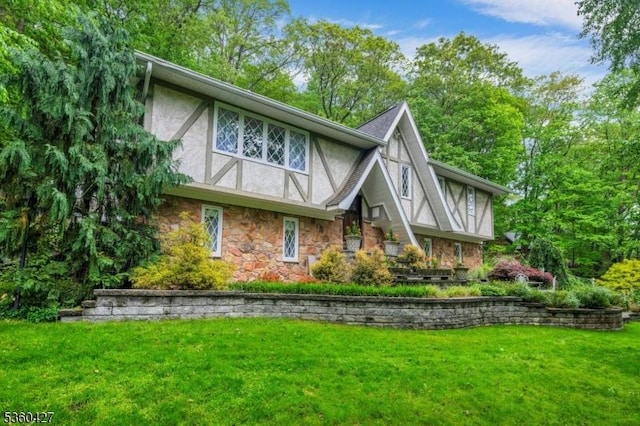 151 Hurd St, Mine Hill Twp, NJ 07803 - rear view of house featuring stone siding, stucco siding, and a yard