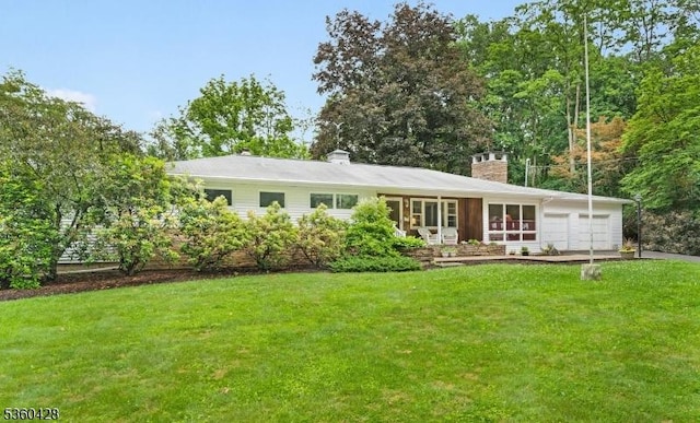 6 Evergreen Pl, Washington Twp, NJ 07840 - view of front facade featuring a garage, a chimney, a front yard, and driveway