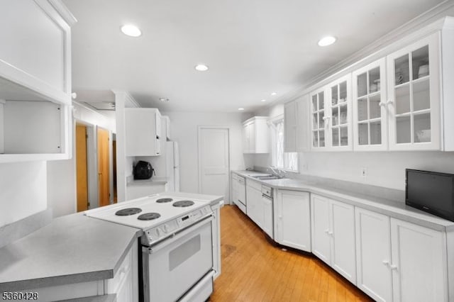 6 Evergreen Pl, Washington Twp, NJ 07840 - kitchen with white electric stove, white cabinets, light wood finished floors, glass insert cabinets, and light countertops