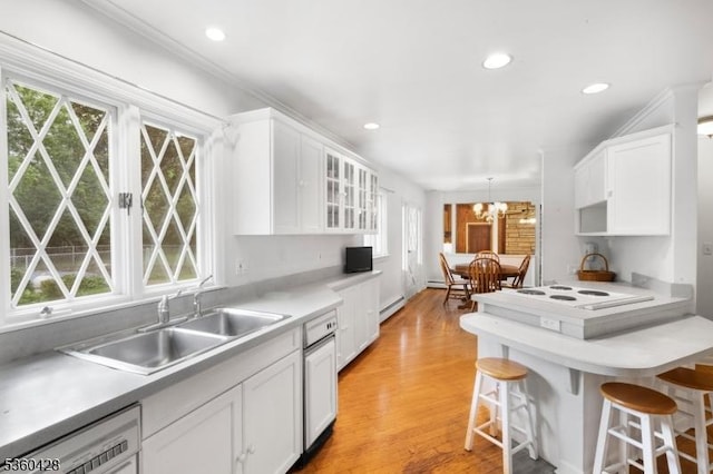 6 Evergreen Pl, Washington Twp, NJ 07840 - kitchen with white cabinetry, healthy amount of natural light, a kitchen breakfast bar, a chandelier, and recessed lighting