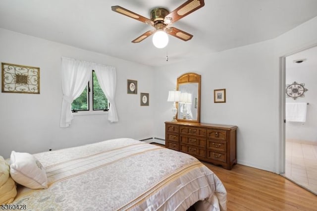 6 Evergreen Pl, Washington Twp, NJ 07840 - bedroom featuring baseboard heating, light wood finished floors, and a ceiling fan