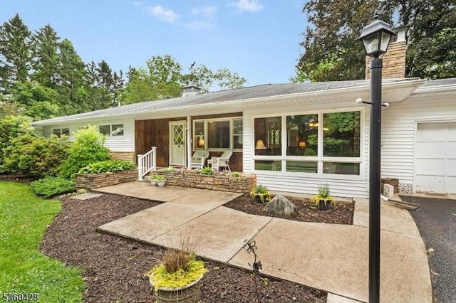 6 Evergreen Pl, Washington Twp, NJ 07840 - ranch-style house featuring a chimney and a garage