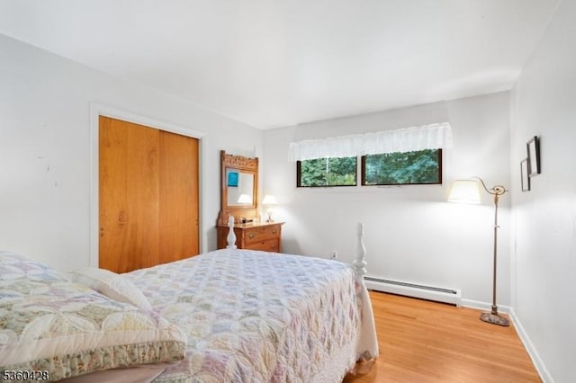 6 Evergreen Pl, Washington Twp, NJ 07840 - bedroom featuring a baseboard radiator, light wood-style floors, and a closet