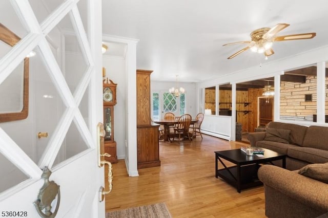 6 Evergreen Pl, Washington Twp, NJ 07840 - living room featuring a ceiling fan, a baseboard heating unit, light wood-style floors, and a chandelier