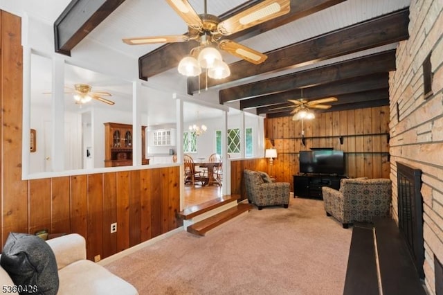 6 Evergreen Pl, Washington Twp, NJ 07840 - carpeted living room featuring wood walls, beamed ceiling, ceiling fan, and a large fireplace