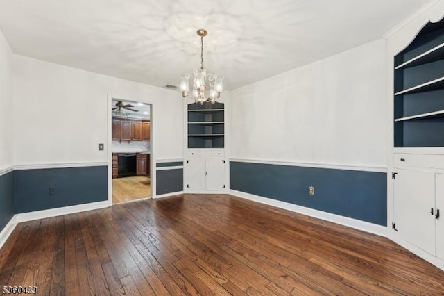 8 Pine Tree Ter, Madison Boro, NJ 07940 - unfurnished room featuring built in features, a chandelier, wood-type flooring, and baseboards