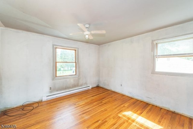 110 Shore Rd, Green Twp, NJ 07821 - unfurnished room featuring a baseboard heating unit, healthy amount of natural light, light wood-style floors, and a ceiling fan