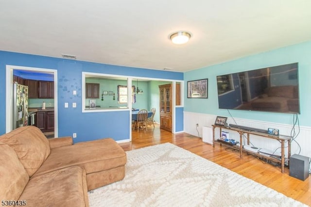 110 Shore Rd, Green Twp, NJ 07821 - living area featuring a wainscoted wall and wood finished floors