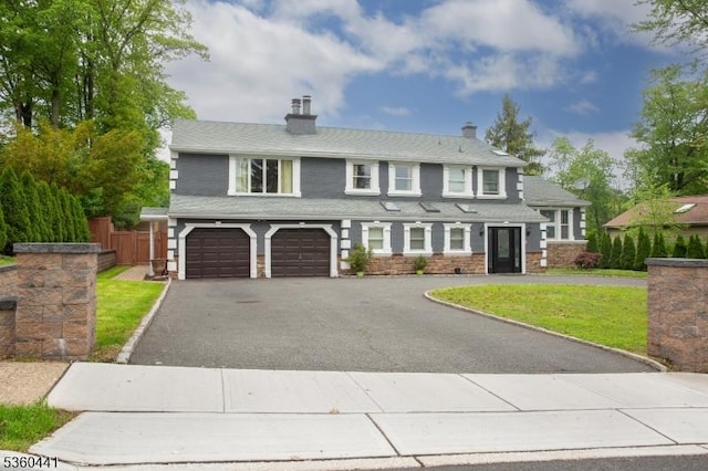 60 Queens Rd, Rockaway Twp, NJ 07866 - view of front of property with an attached garage, driveway, a chimney, and stone siding