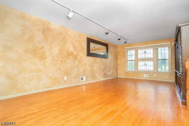 60 Queens Rd, Rockaway Twp, NJ 07866 - unfurnished room featuring rail lighting, light wood-type flooring, and baseboards