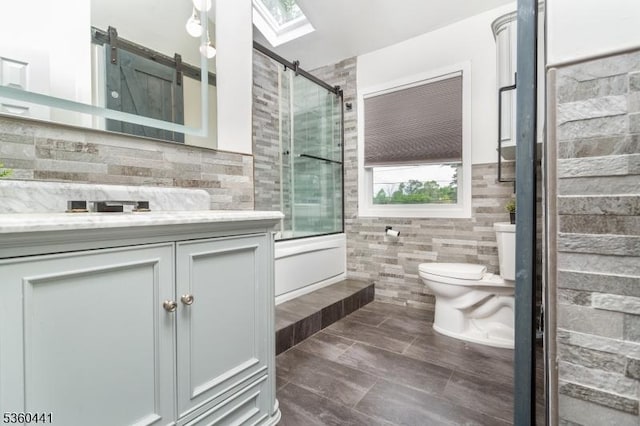 60 Queens Rd, Rockaway Twp, NJ 07866 - full bath with toilet, vanity, tile walls, a shower with shower door, and a skylight