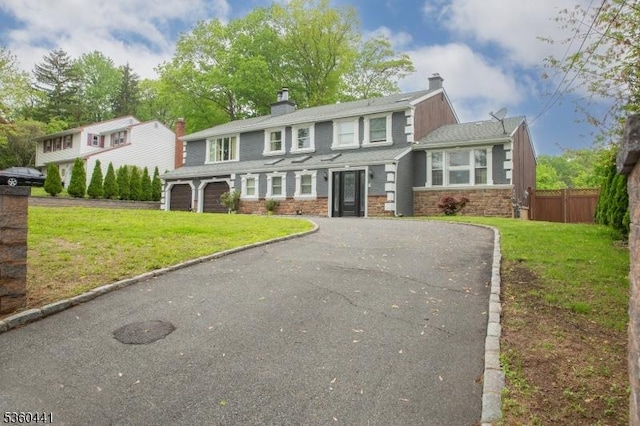60 Queens Rd, Rockaway Twp, NJ 07866 - view of front of property with driveway, a chimney, stone siding, and an attached garage