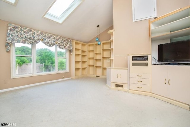 60 Queens Rd, Rockaway Twp, NJ 07866 - unfurnished living room with lofted ceiling, a skylight, light carpet, and baseboards