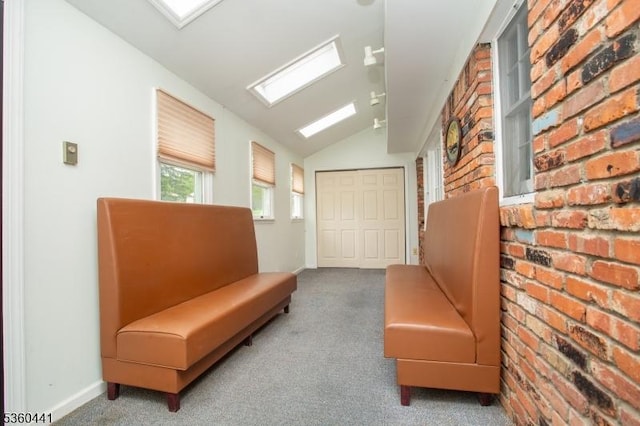 60 Queens Rd, Rockaway Twp, NJ 07866 - living area with vaulted ceiling, carpet flooring, brick wall, and baseboards