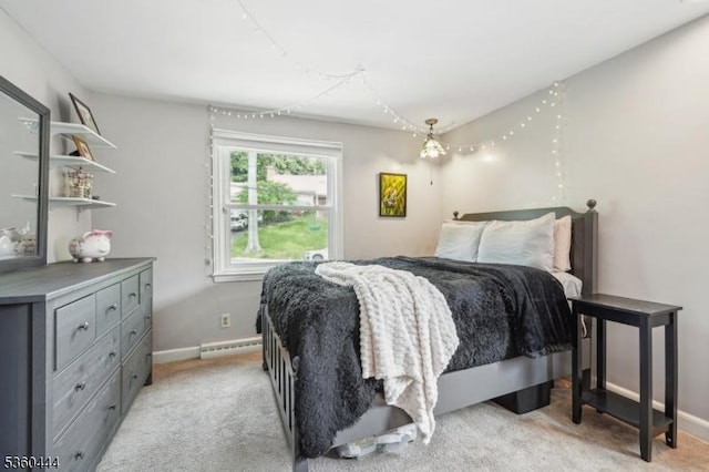 12 Beaumont Ter, West Orange Twp, NJ 07052 - bedroom with a baseboard heating unit, light carpet, and baseboards