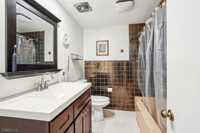 12 Beaumont Ter, West Orange Twp, NJ 07052 - full bathroom with tile walls, toilet, vanity, tile patterned flooring, and shower / bath combination with curtain