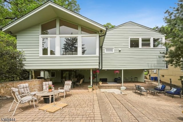 12 Beaumont Ter, West Orange Twp, NJ 07052 - rear view of house with a patio area