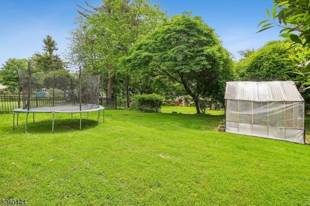12 Beaumont Ter, West Orange Twp, NJ 07052 - view of yard with an exterior structure, a trampoline, and an outbuilding