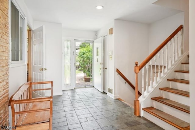 12 Beaumont Ter, West Orange Twp, NJ 07052 - foyer entrance featuring baseboards, stone tile flooring, stairway, and recessed lighting