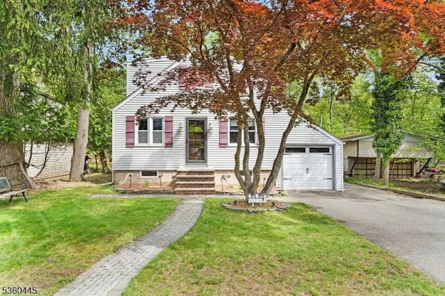 624 New St, River Vale Twp, NJ 07675 - view of front of property with a garage, asphalt driveway, and a front yard