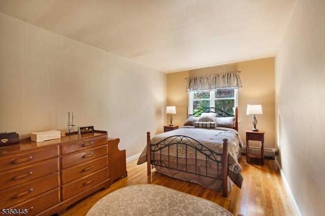 624 New St, River Vale Twp, NJ 07675 - bedroom featuring wood finished floors, baseboards, and baseboard heating