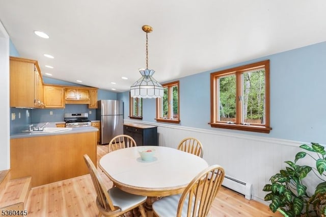 624 New St, River Vale Twp, NJ 07675 - dining space featuring a baseboard radiator, light wood finished floors, a wainscoted wall, vaulted ceiling, and recessed lighting