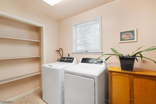 624 New St, River Vale Twp, NJ 07675 - laundry room with cabinet space, washing machine and clothes dryer, light tile patterned floors, and baseboards