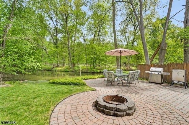 624 New St, River Vale Twp, NJ 07675 - view of patio featuring an outdoor fire pit, area for grilling, and a water view