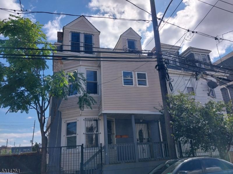 71 N 5th St, Newark City, NJ 07107 - view of front facade featuring a fenced front yard
