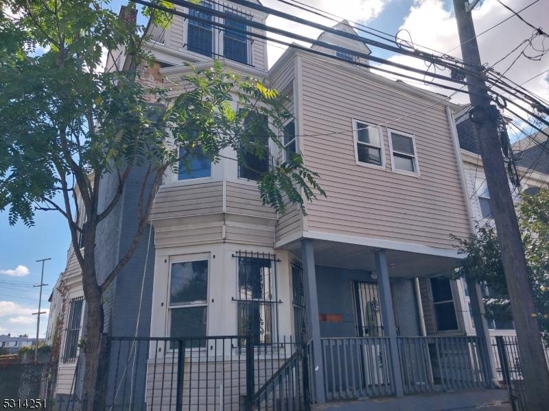 71 N 5th St, Newark City, NJ 07107 - view of side of home with covered porch