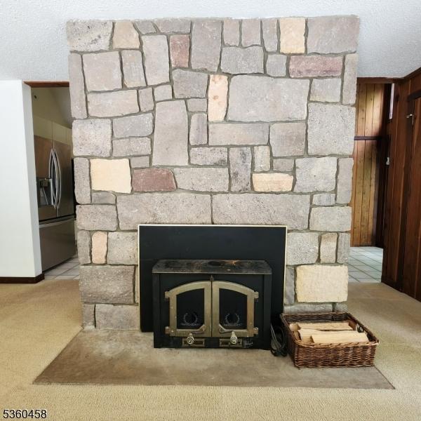 161 Neilson Rd, Wantage Twp, NJ 07461 - detailed view of carpet flooring and stainless steel fridge