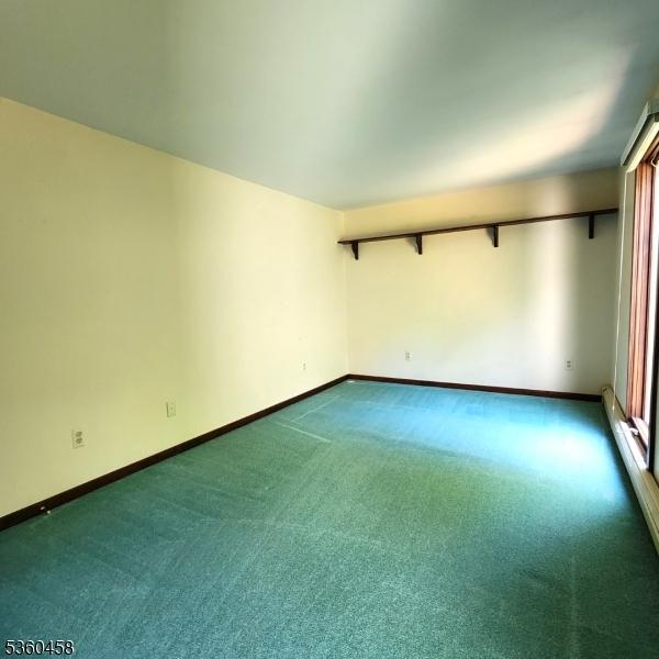 161 Neilson Rd, Wantage Twp, NJ 07461 - empty room featuring dark colored carpet and baseboards