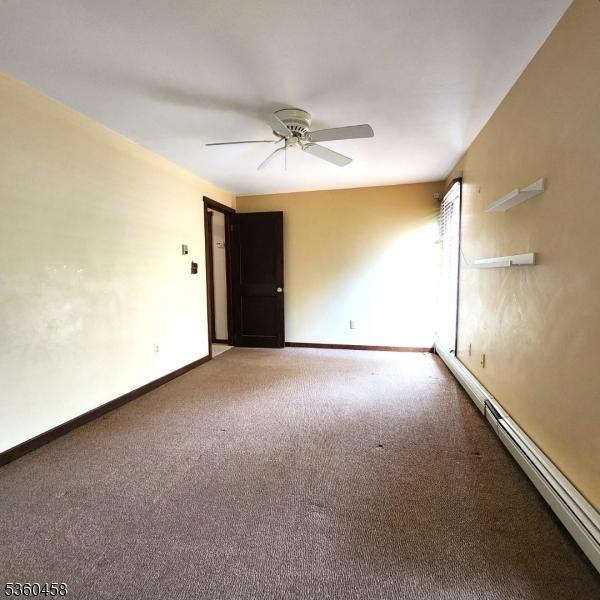 161 Neilson Rd, Wantage Twp, NJ 07461 - spare room with carpet flooring, a ceiling fan, a baseboard heating unit, and baseboards