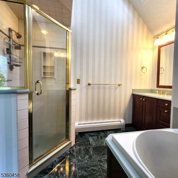 161 Neilson Rd, Wantage Twp, NJ 07461 - bathroom featuring a baseboard heating unit, wallpapered walls, vanity, a shower stall, and a bath