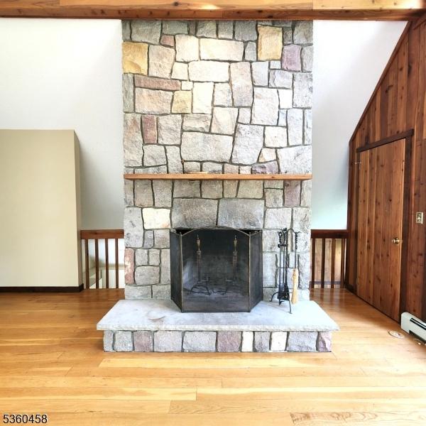 161 Neilson Rd, Wantage Twp, NJ 07461 - detailed view of wood finished floors, a fireplace, and baseboards