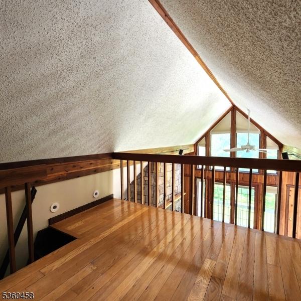 161 Neilson Rd, Wantage Twp, NJ 07461 - additional living space with lofted ceiling, a textured ceiling, and a ceiling fan