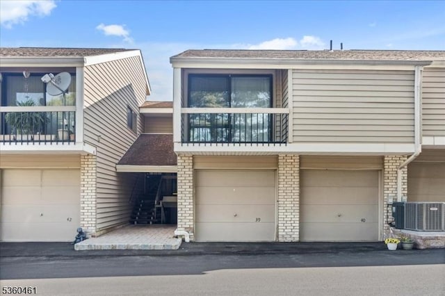 39 Hillside Ct, Union Twp, NJ 08809 - view of front facade featuring an attached garage and a balcony